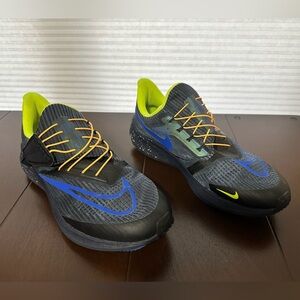 Nike Black and Blue Sneakers with Yellow and Orange Accents